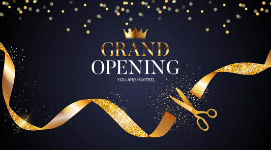 Grand opening invitation graphic with gold ribbon and scissors on a dark background.