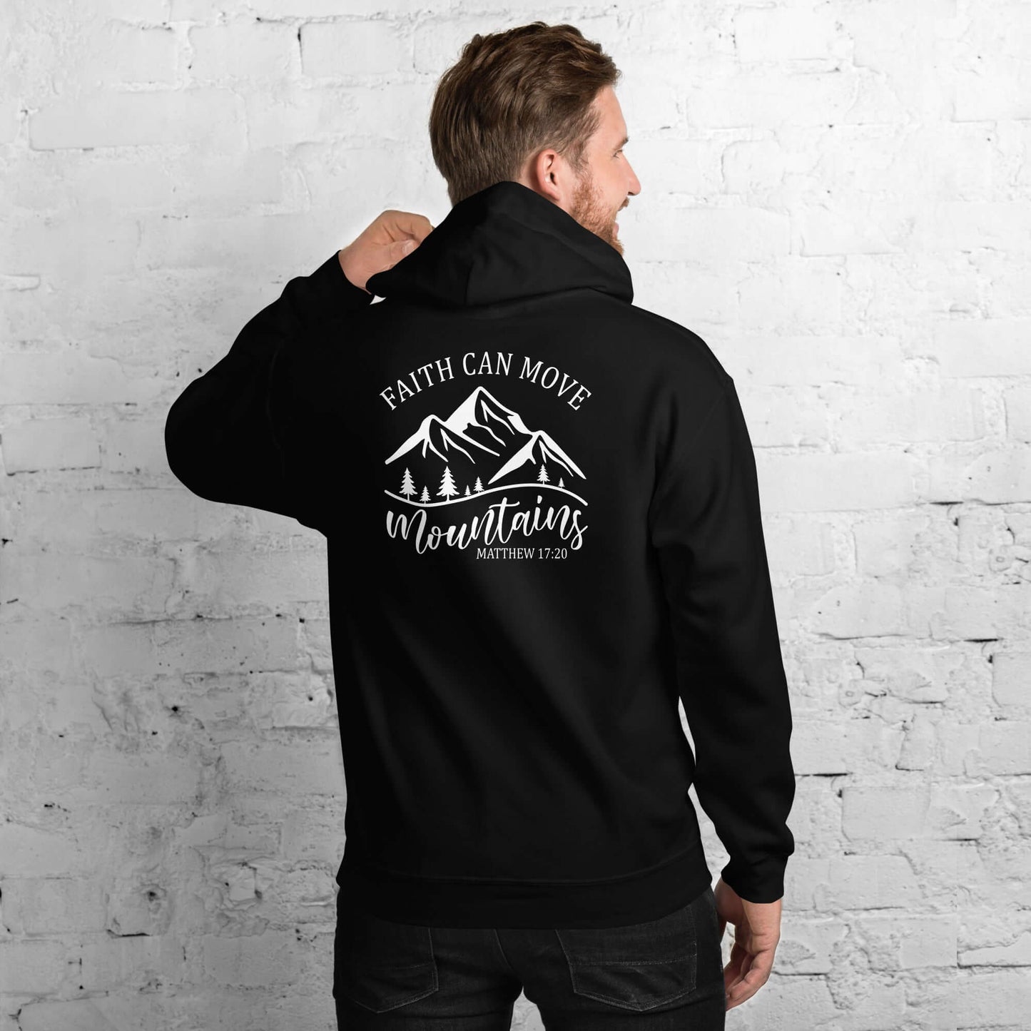 Black unisex hoodie featuring "Faith Can Move Mountains" design, ideal for Christian clothing in the UK.