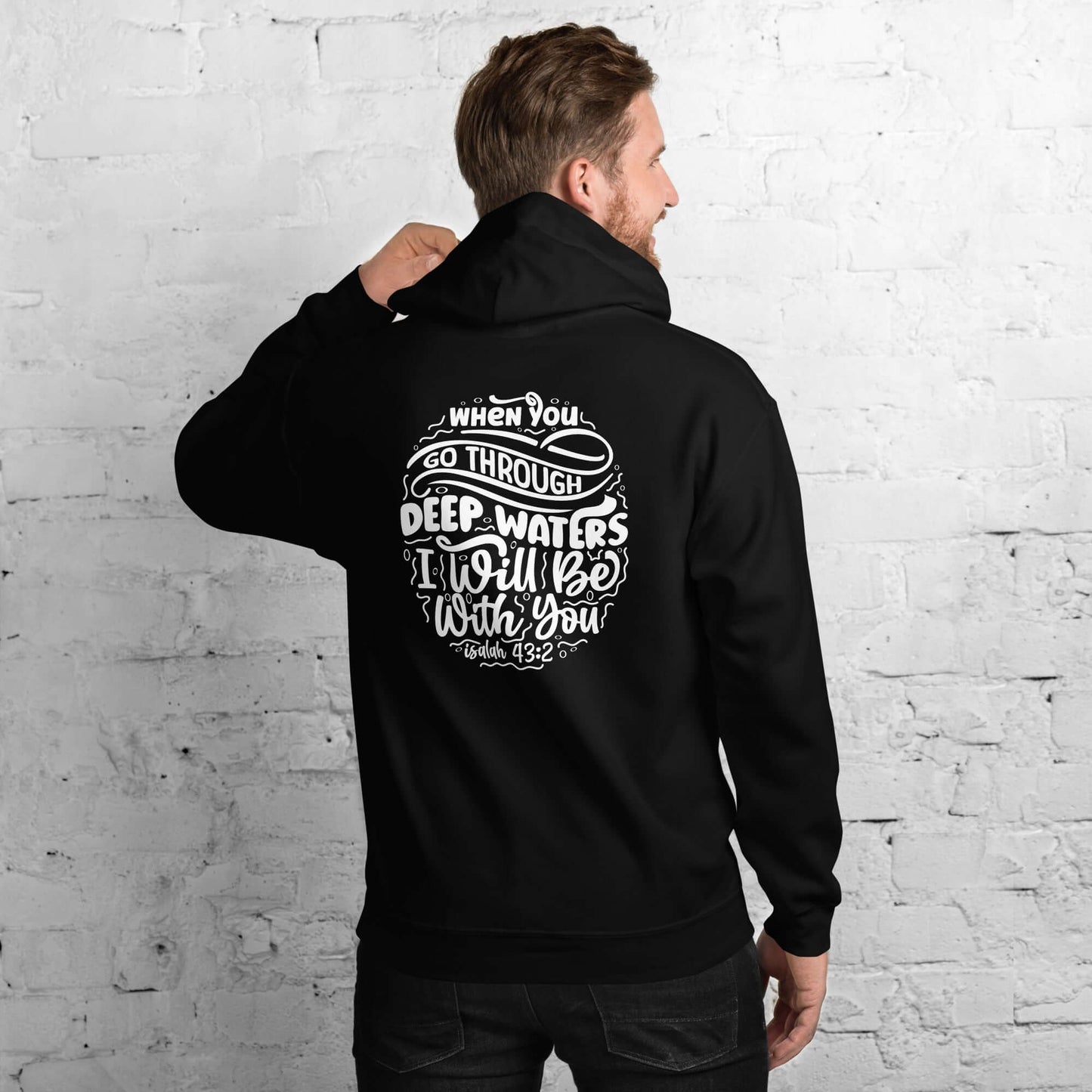 Man wearing 'Through Deep Waters' hoodie with Isaiah 43:2 quote, inspirational Christian clothing UK