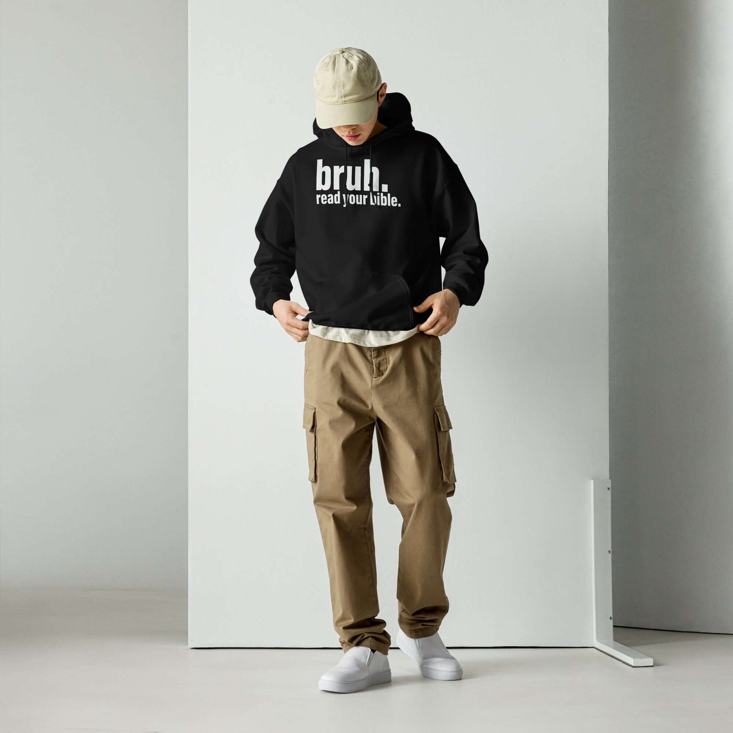 Unisex "Bruh, Read Your Bible" Christian hoodie worn with beige cargo pants, promoting Christian apparel in the UK.