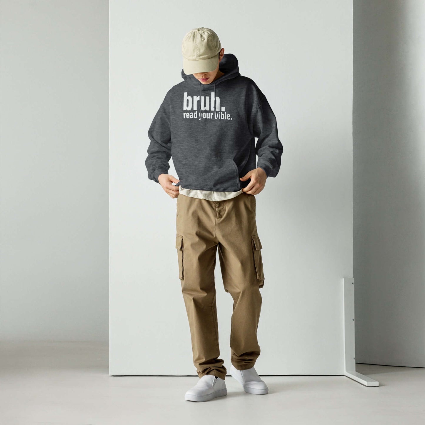 Unisex "Bruh, Read Your Bible" hoodie in dark gray, casual outfit, promoting Christian clothing style.