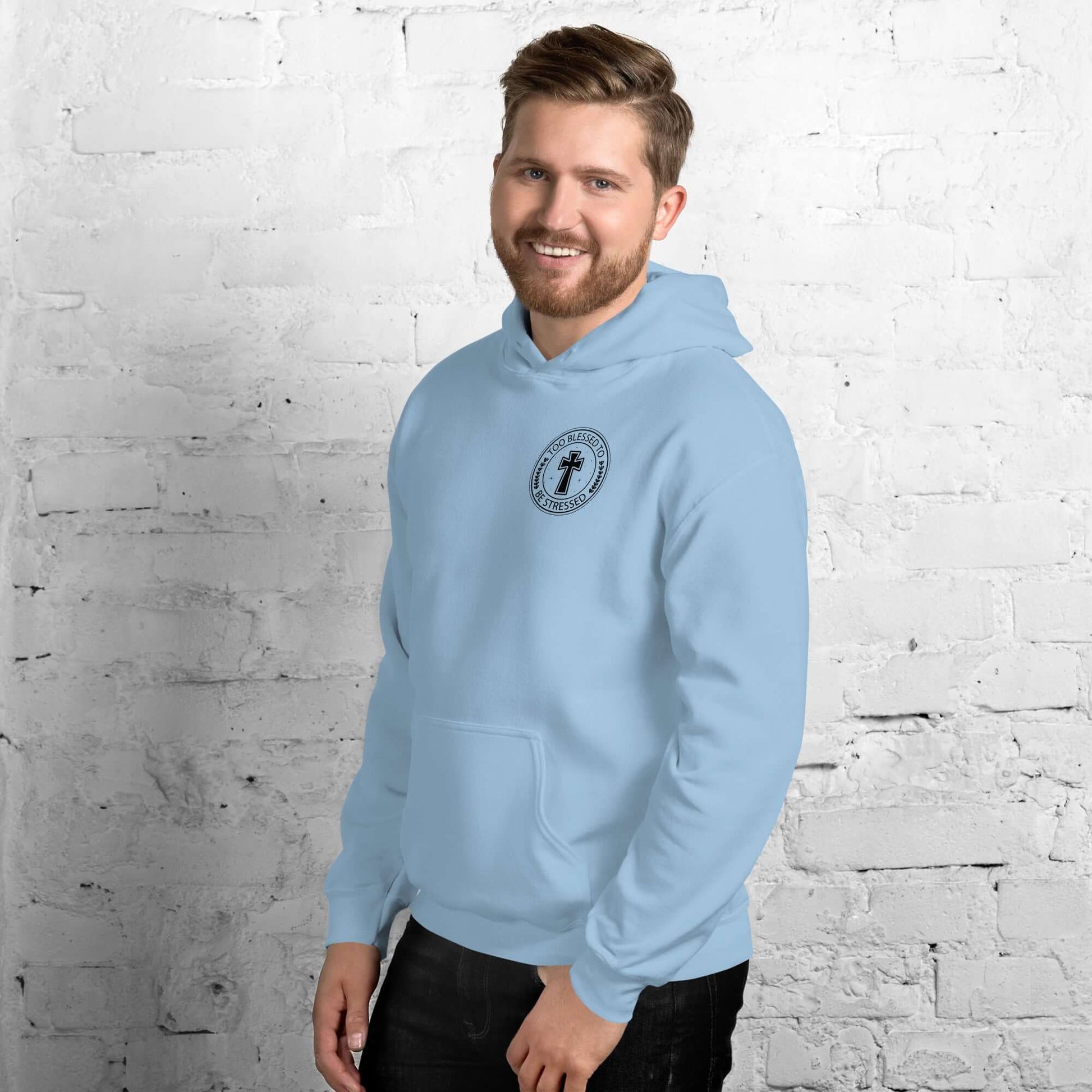 Man wearing a light blue "Too Blessed to Be Stressed" Christian hoodie, showcasing faith-inspired apparel.