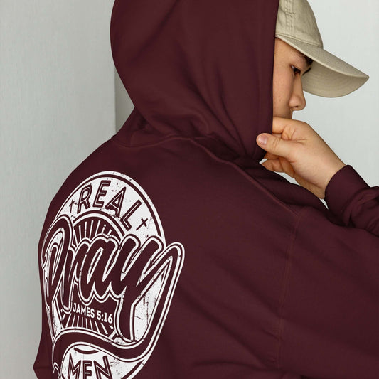 Real Men Pray men's Christian hoodie, burgundy, showcasing prayer message and design, perfect for faith-based fashion in the UK.