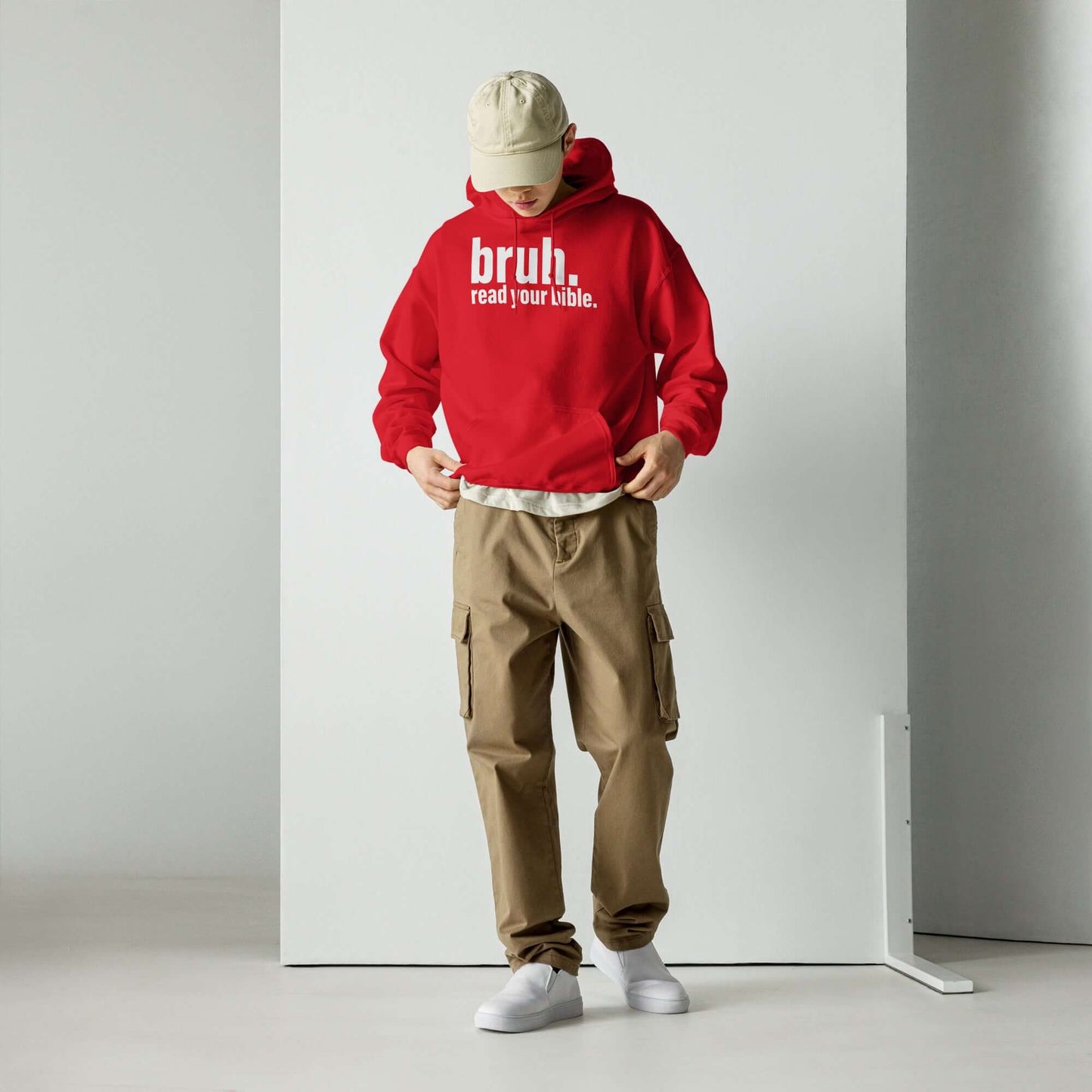 Man wearing a Red "Bruh, Read Your Bible" hoodie paired with khaki cargo pants, promoting Christian apparel style.