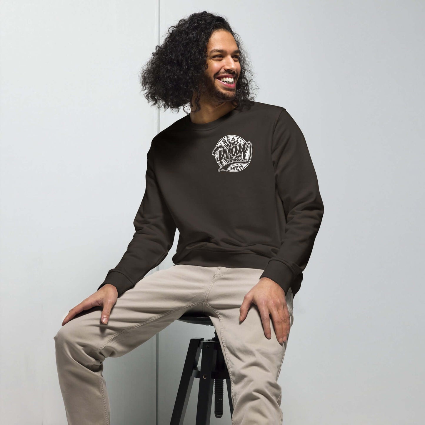 Men's organic "Real Men Pray" sweatshirt, a bold Christian clothing statement for faith and inspiration in the UK.