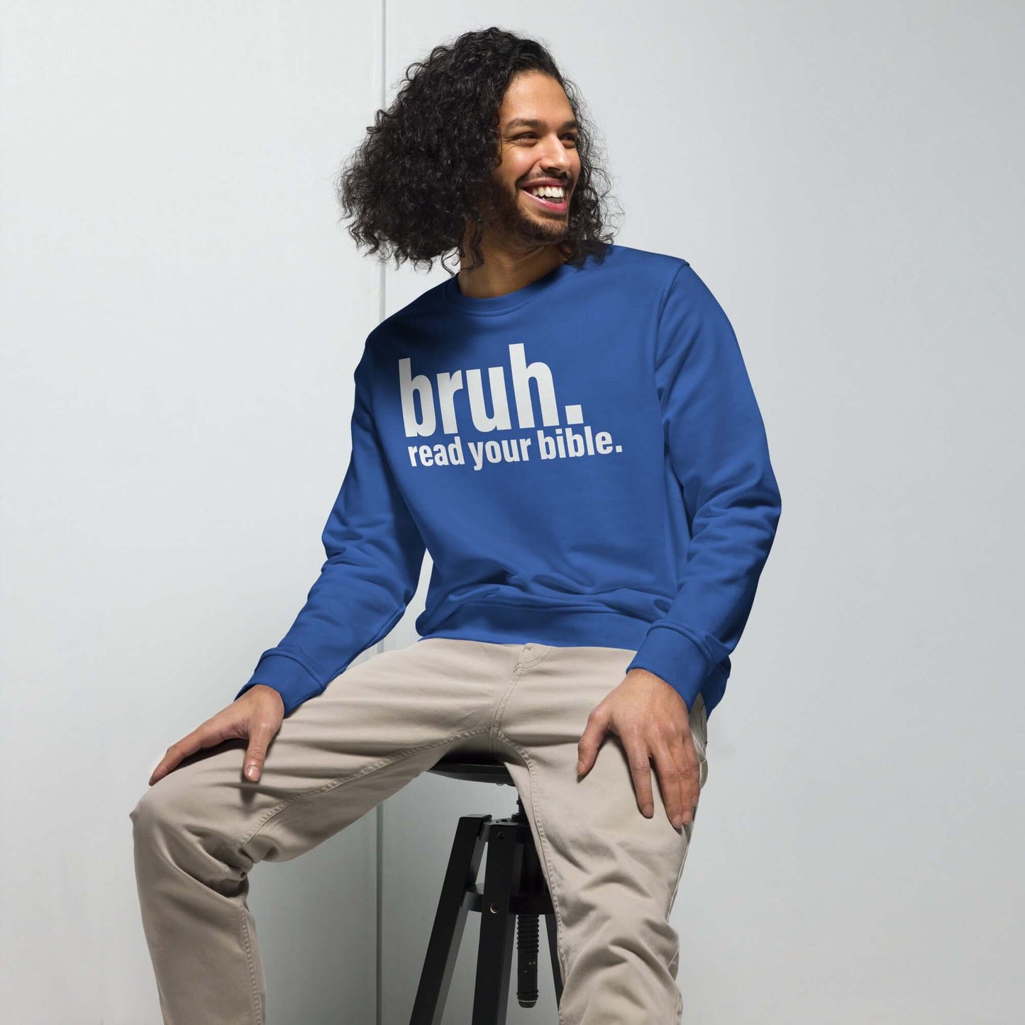 Christian sweatshirt "Bruh, read your bible" worn by a young man, promoting Scripture wisdom and conversation.