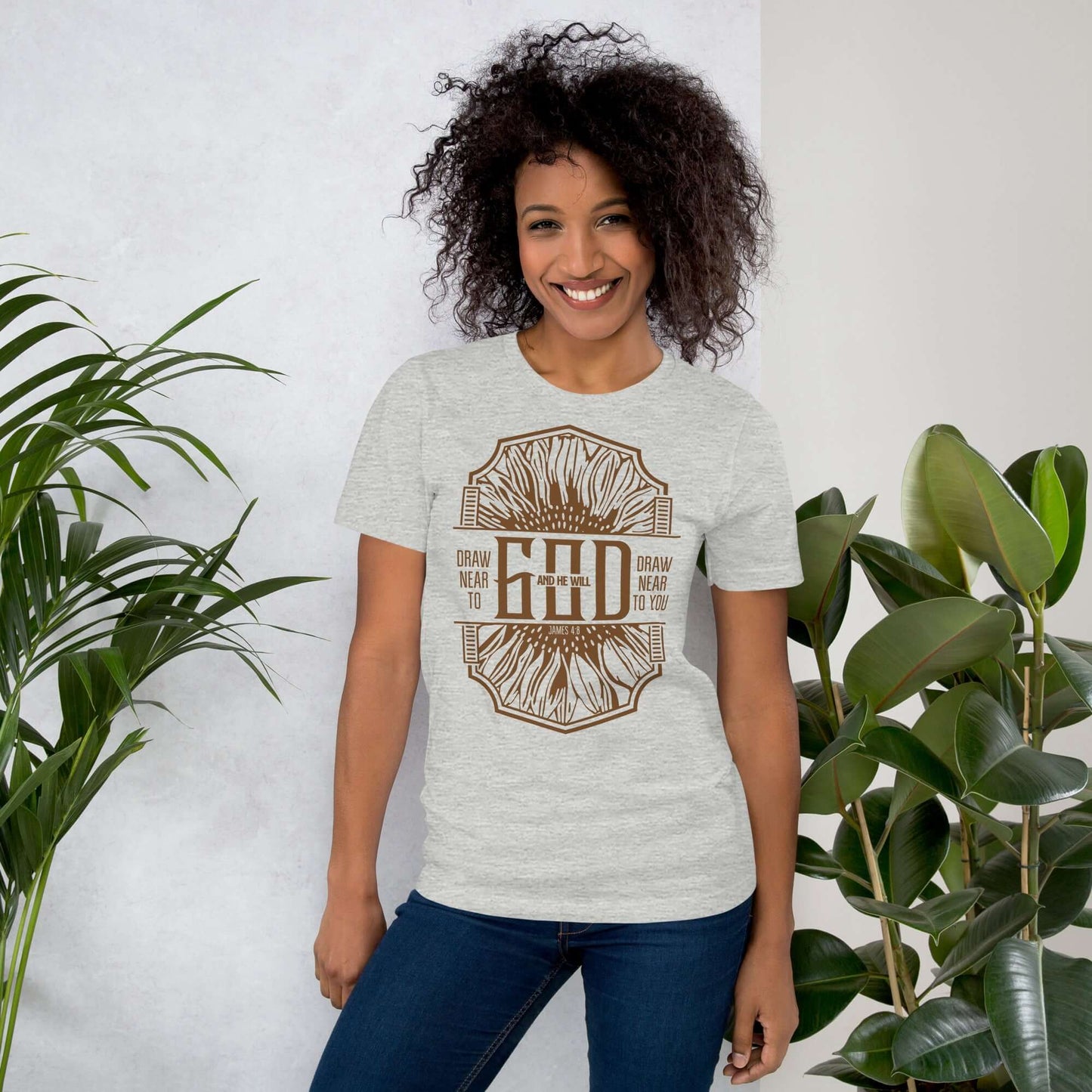 Woman wearing Draw Near to God Christian T-shirt, featuring inspirational typography on a gray background.