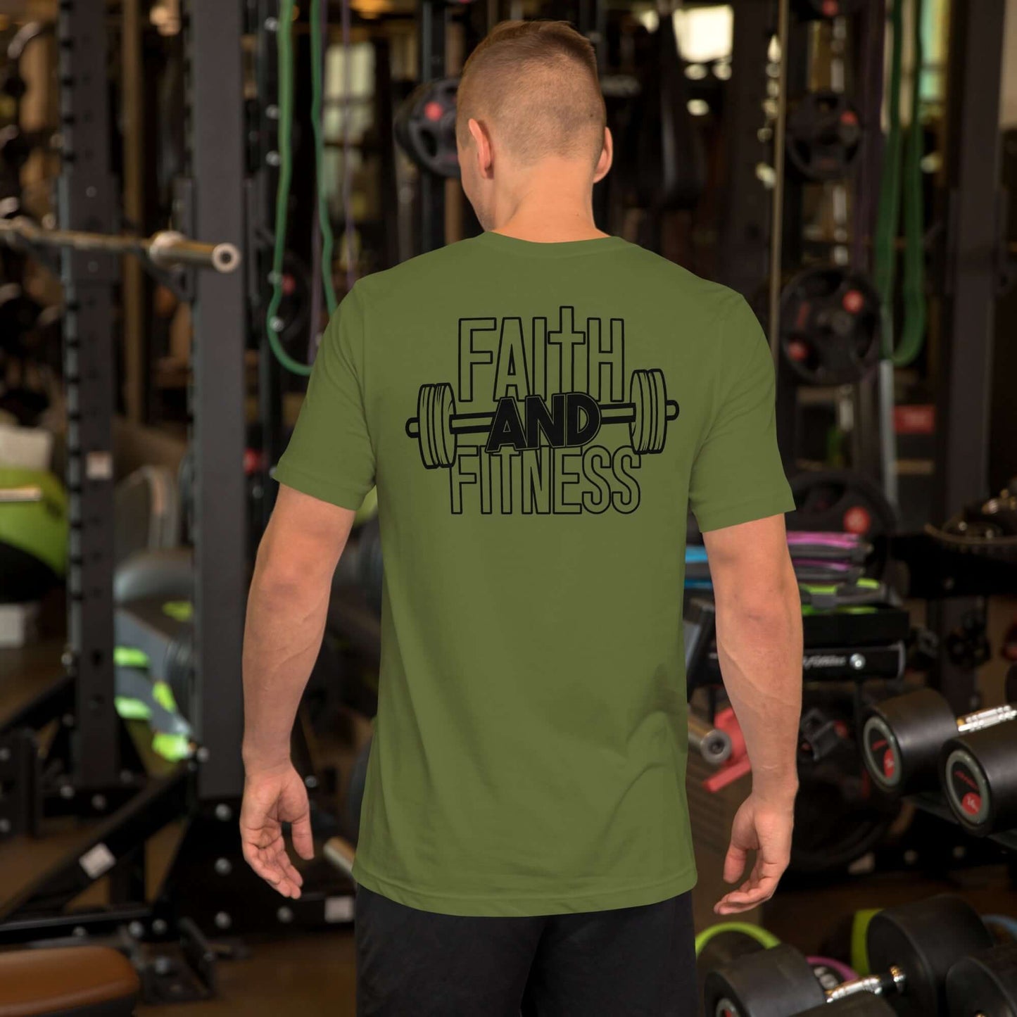 Man wearing olive green "Faith and Fitness" Christian T-shirt in gym, promoting strength through faith.