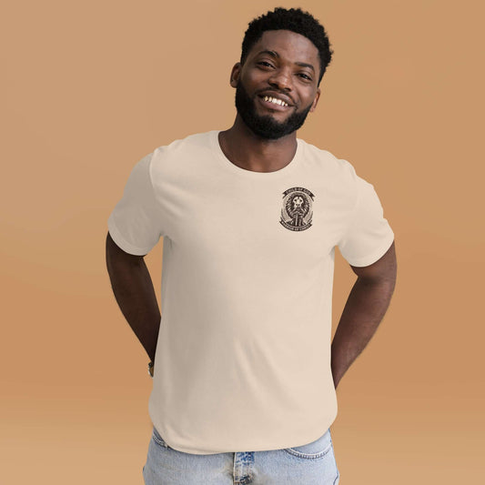 Smiling man wearing a beige 'Child of God, Warrior of Christ' Christian t-shirt inspired by Ephesians 6:10-11, representing Christian clothing UK.