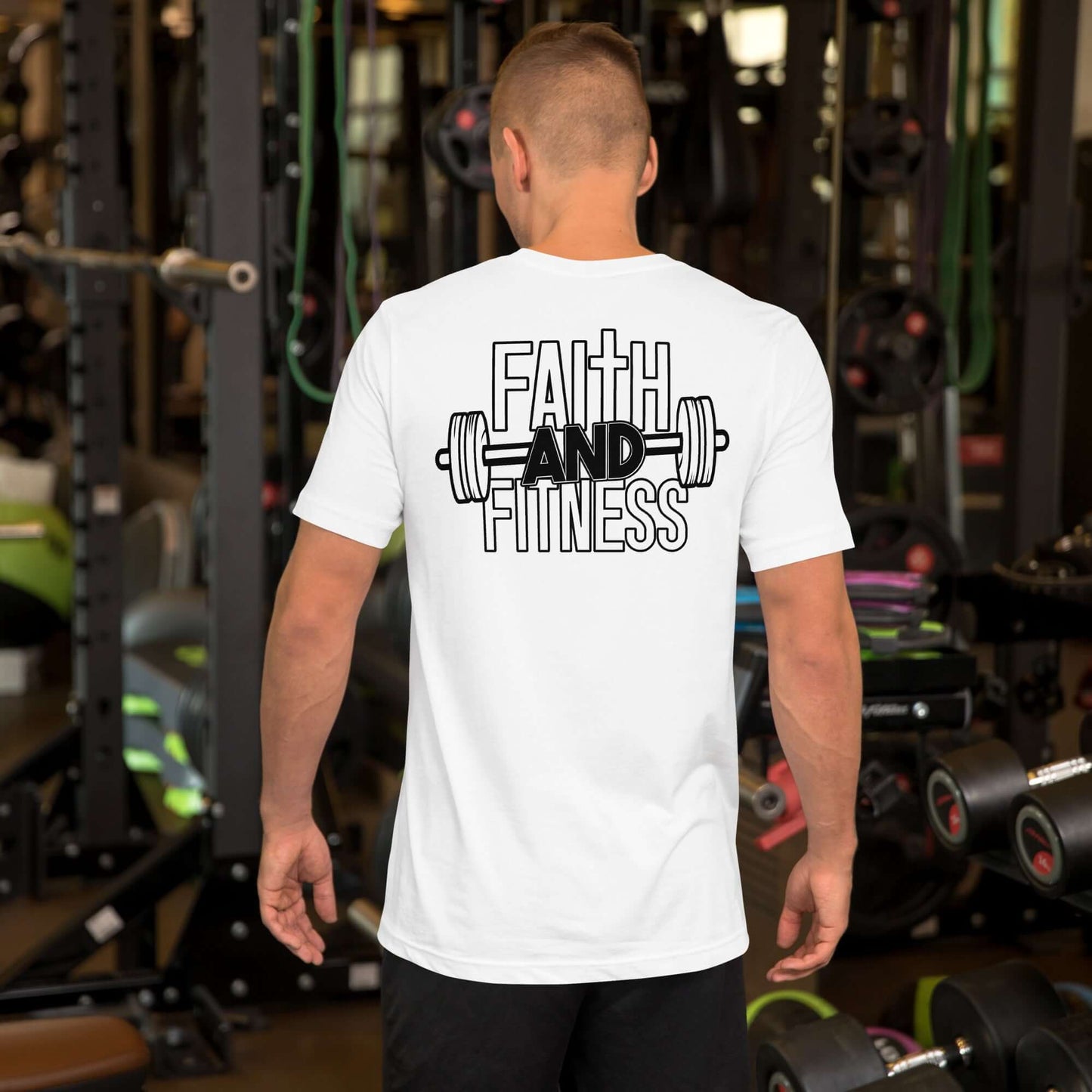 Back view of a man wearing a white Faith and Fitness Christian T-shirt in a gym setting, promoting spiritual and physical strength.